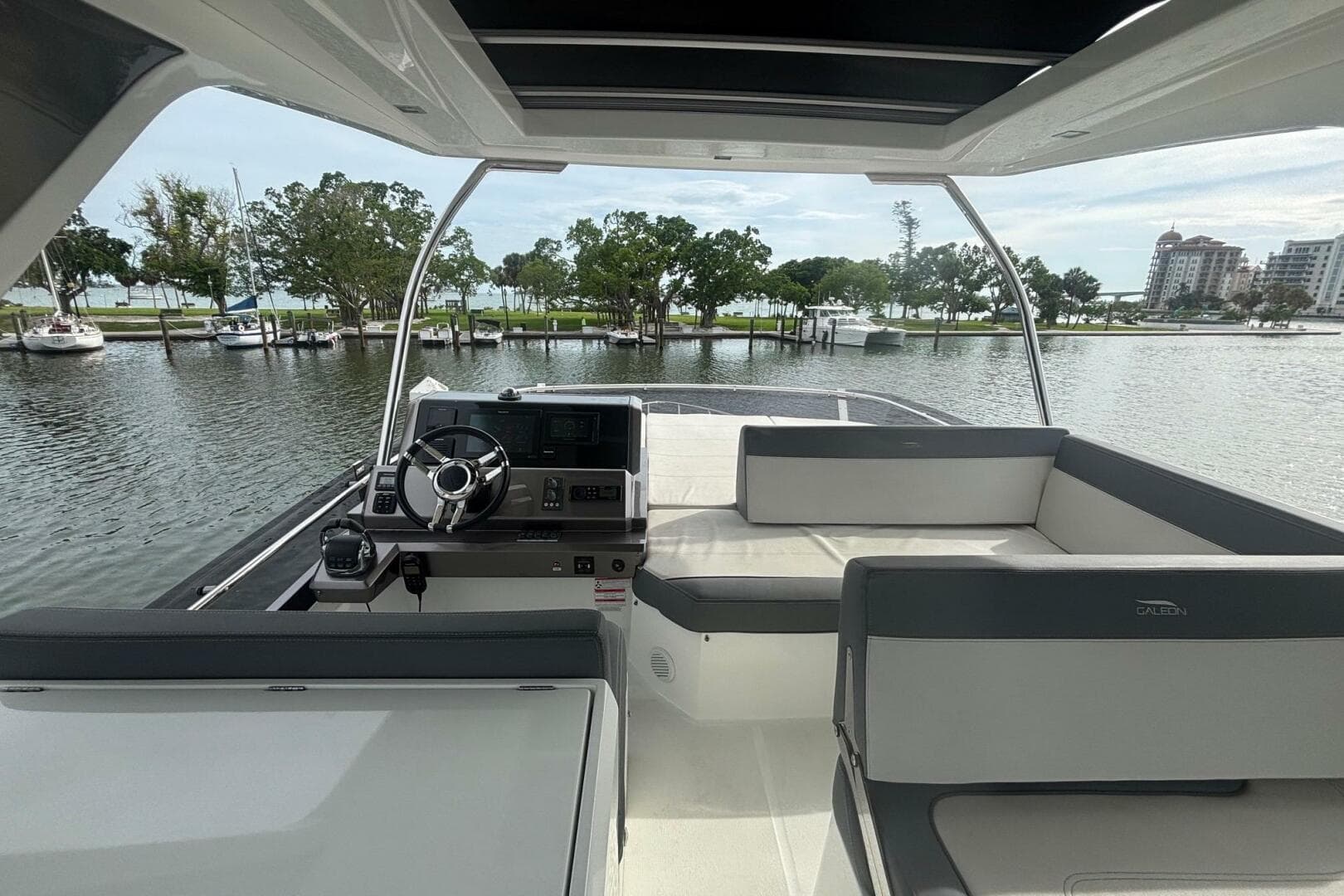 Interior view of 2020 Galeon 500 Fly yacht with helm and seating area.