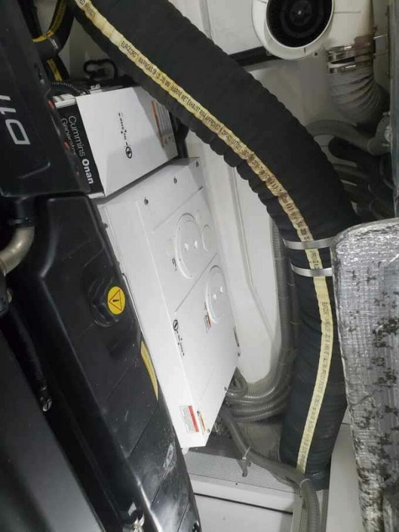 Engine room of a 2020 Galeon 500 Fly yacht with Cummins Onan generator.