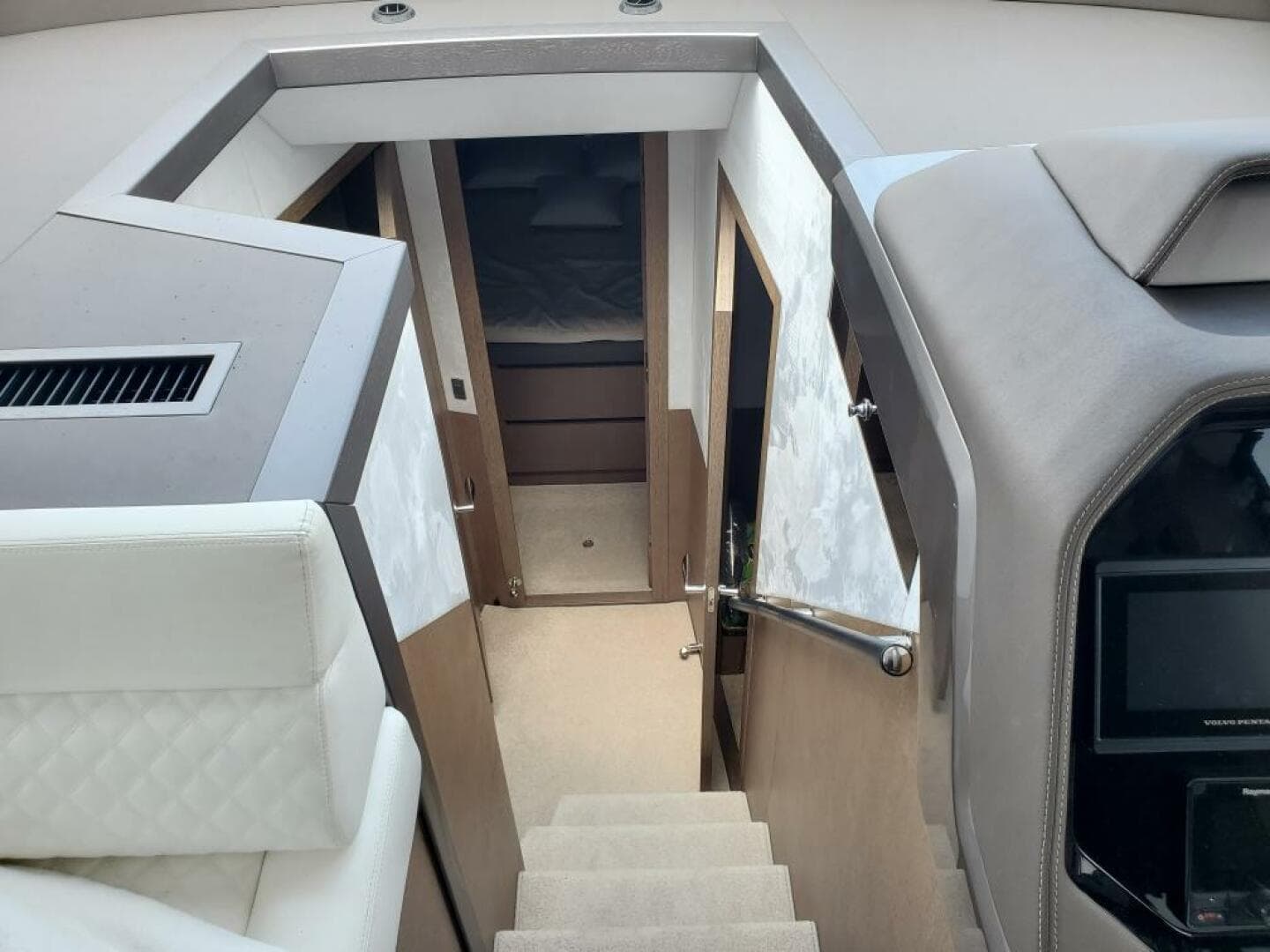 Interior cabin of 2020 Galeon 500 Fly yacht with stairs and seating.