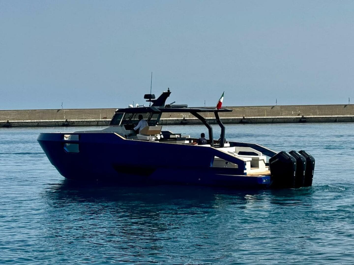 Aicon Audace 50 yacht, 2025 model, cruising in a calm harbor.