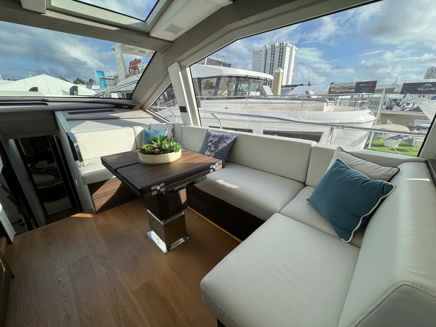 Luxurious interior of 2024 Aicon 66 Vivere yacht with plush seating and modern decor.