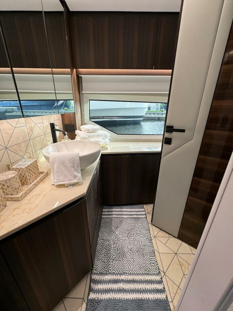 Luxurious bathroom interior of 2024 Aicon 66 Vivere yacht with modern fixtures and elegant design.