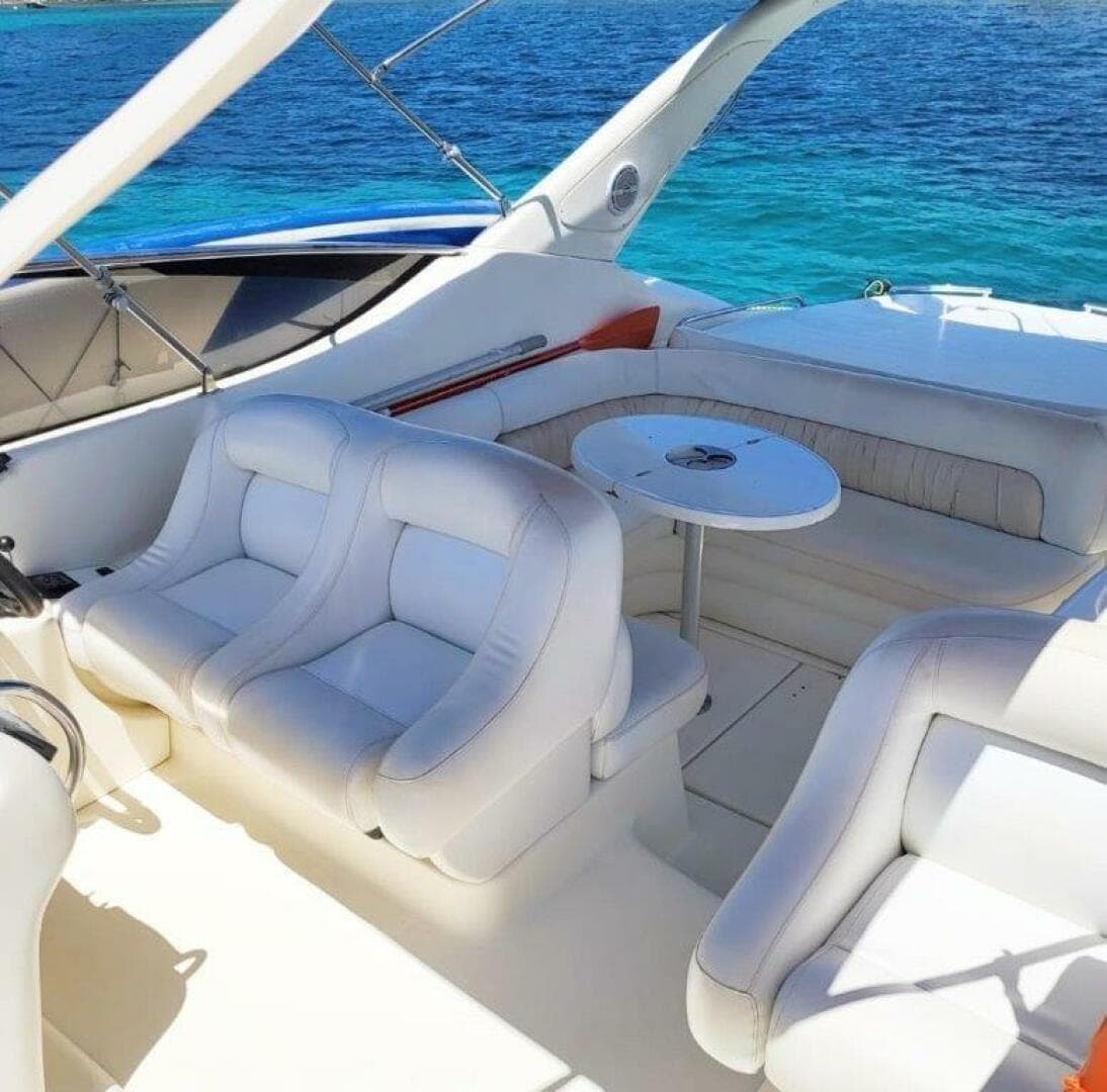 2003 Cranchi Endurance 39 yacht interior with white seating and ocean view.