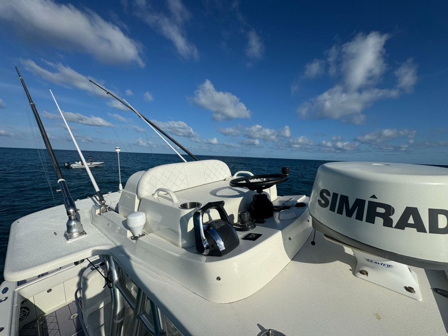 2017 SeaVee 340Z boat with Simrad equipment on open water under blue sky.