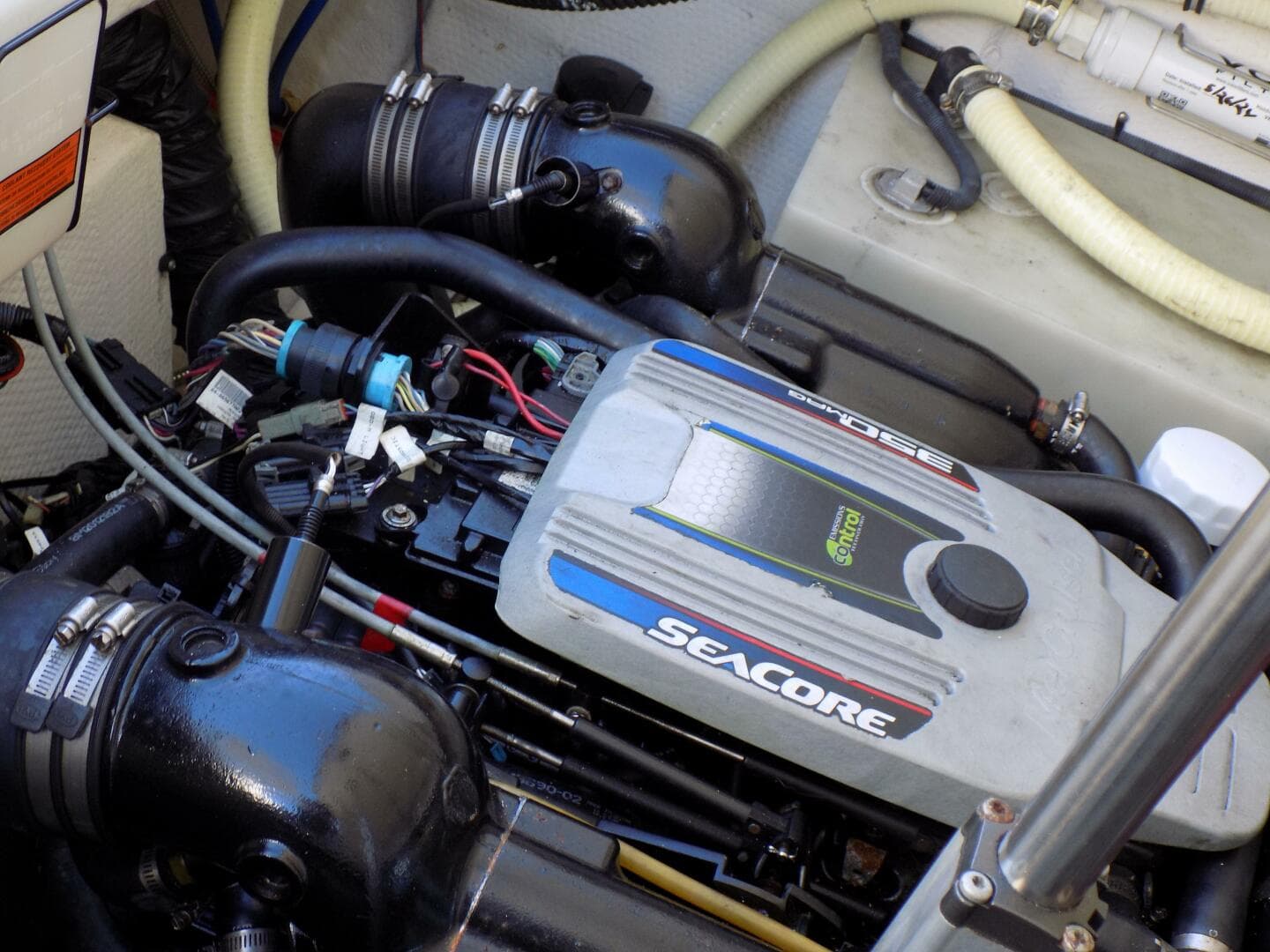 Portside engine adjacent to holding tank