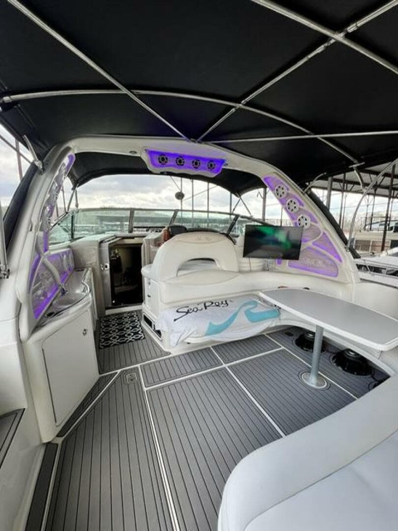 2003 Sea Ray 380 Sundancer yacht interior with modern seating and ambient lighting.