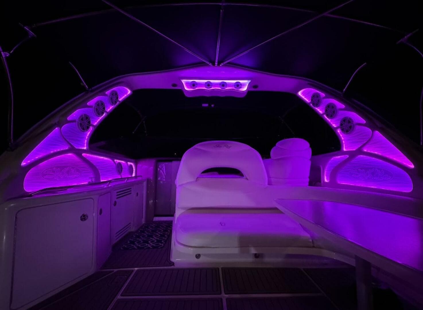 Interior of 2003 Sea Ray 380 Sundancer with vibrant purple LED lighting.