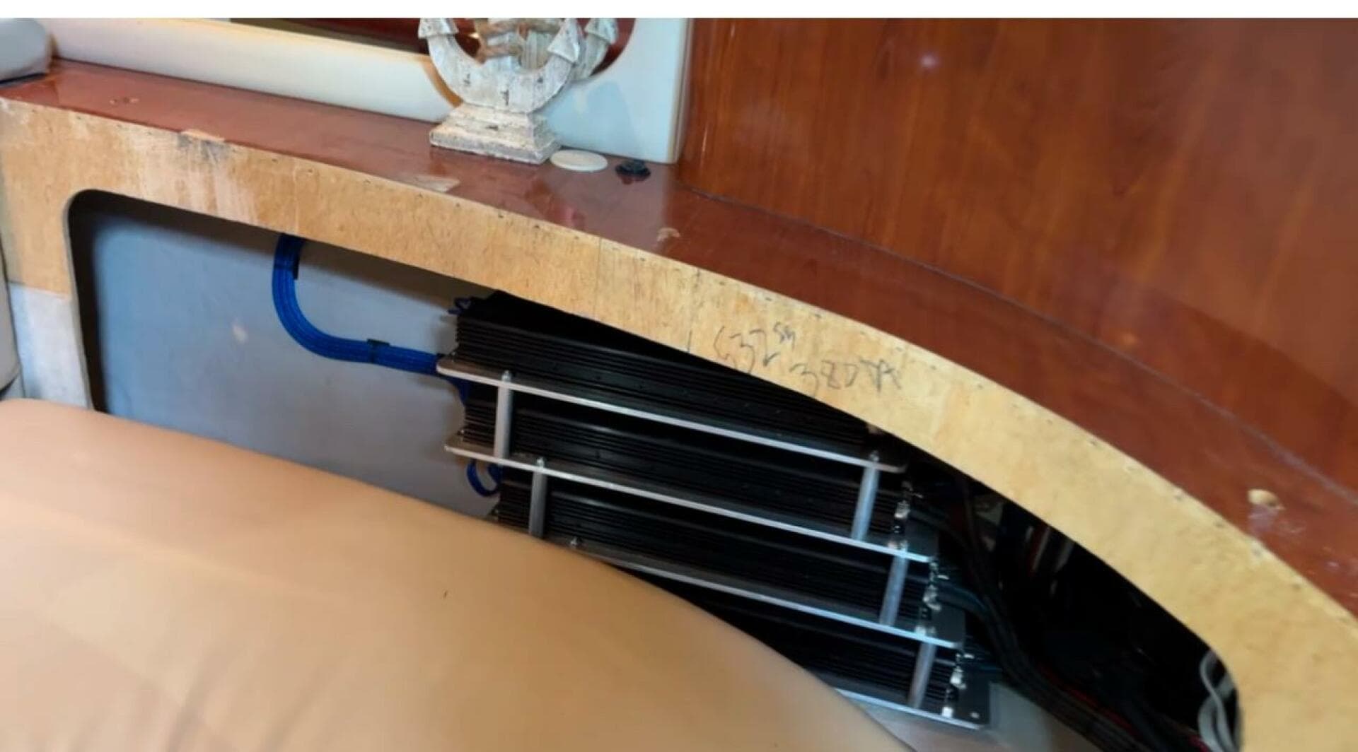 2003 Sea Ray 380 Sundancer interior detail with visible equipment and wood finish.