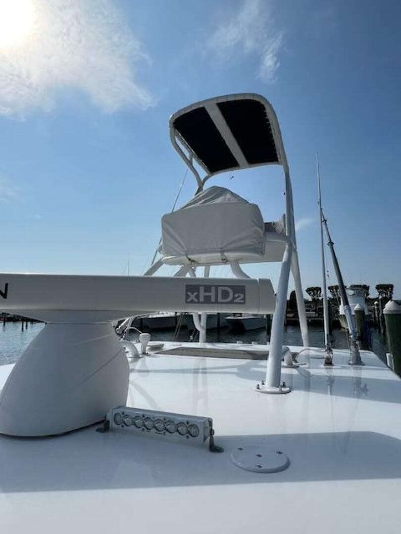 2020 SeaHunter 39 Tournament boat with radar and fishing equipment under a clear blue sky.