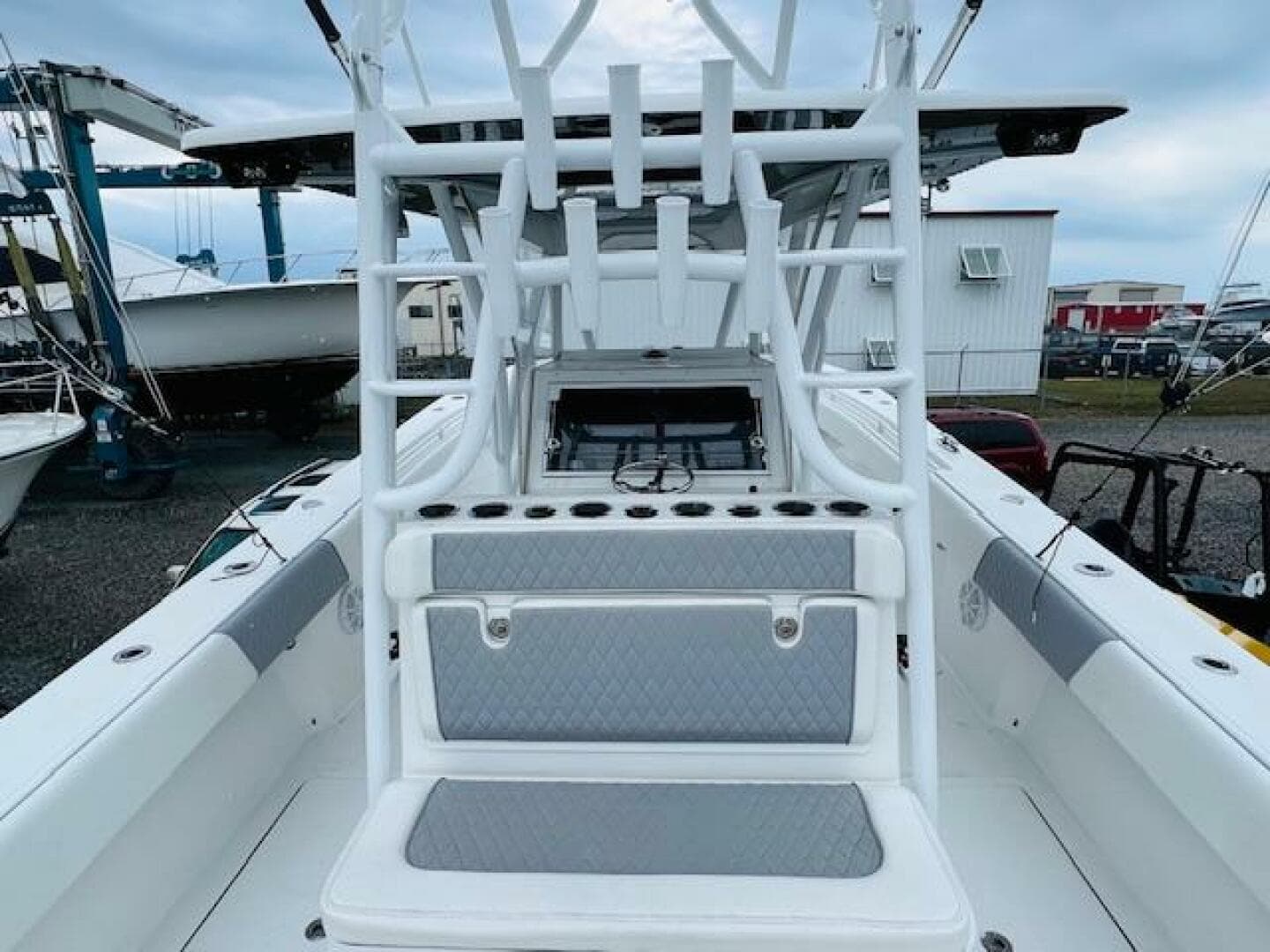 2020 SeaHunter 39 Tournament boat interior with rod holders and seating, docked at a marina.