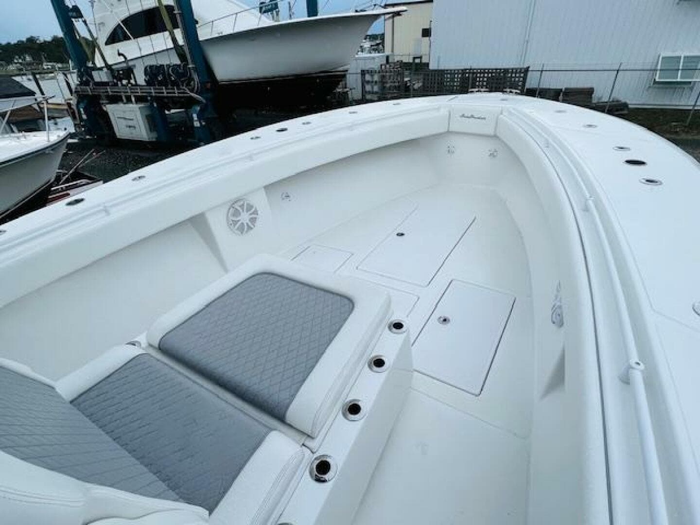 2020 SeaHunter 39 Tournament boat interior with cushioned seating and storage compartments.