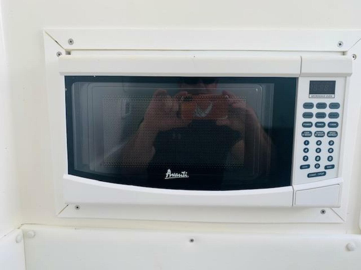 Built-in Avanti microwave in 2020 SeaHunter 39 Tournament boat kitchen.
