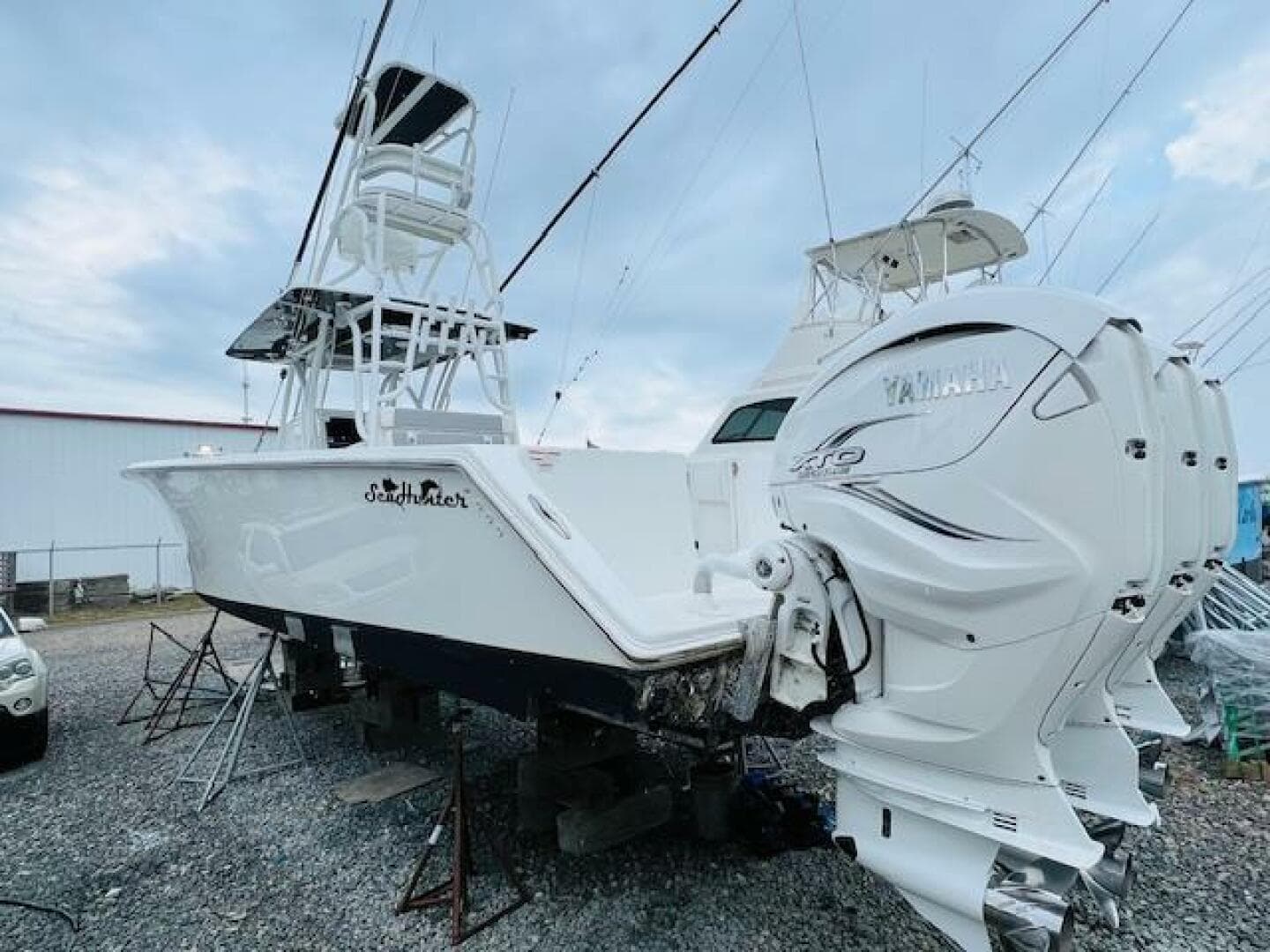 2020 SeaHunter 39 Tournament boat with Yamaha engines, displayed on stands outdoors.