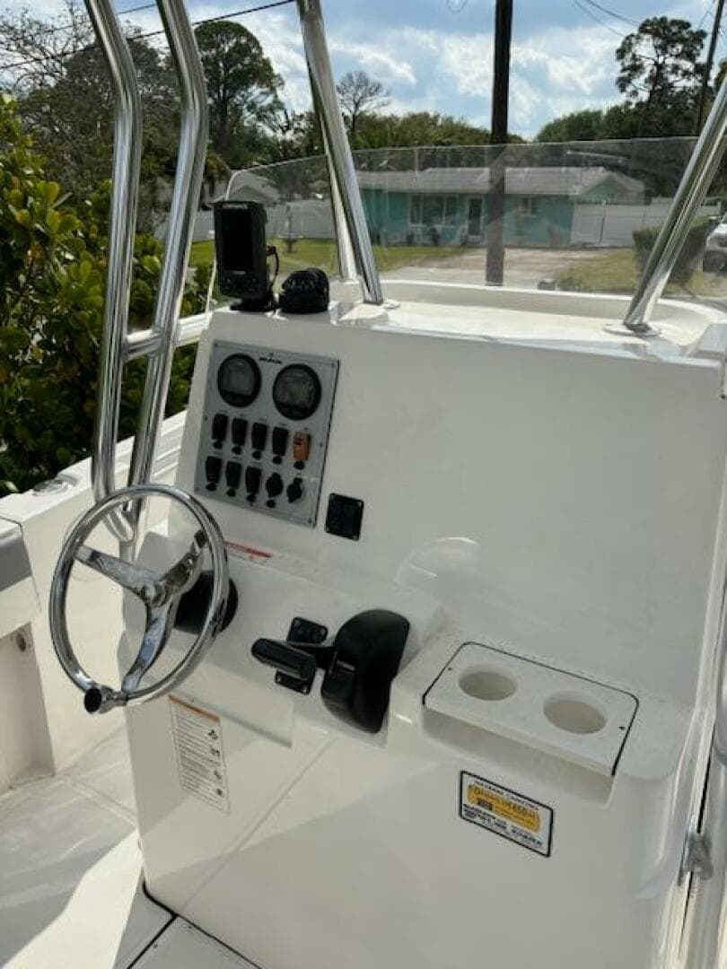 2016 Release 208 RX boat console with steering wheel and control panel.