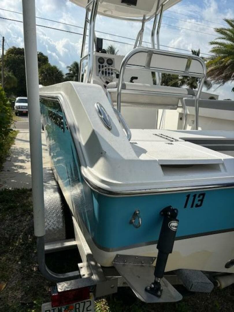 2016 Release 208 RX boat with blue and white exterior on a trailer.