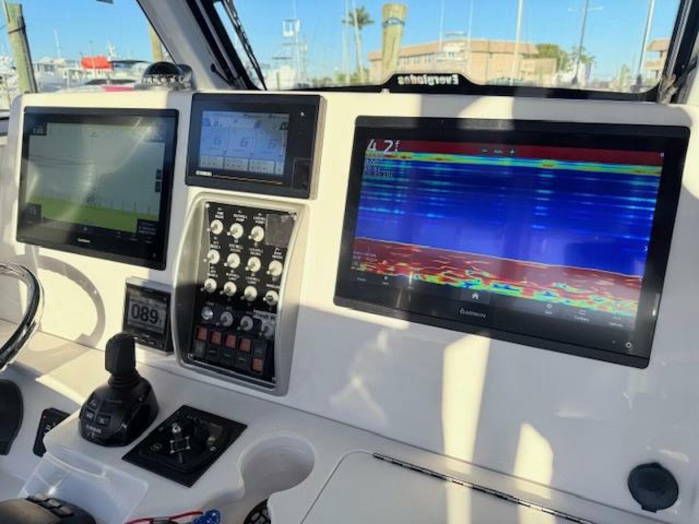 Control panel of 2014 Everglades 355 Center Console with navigation screens and controls.