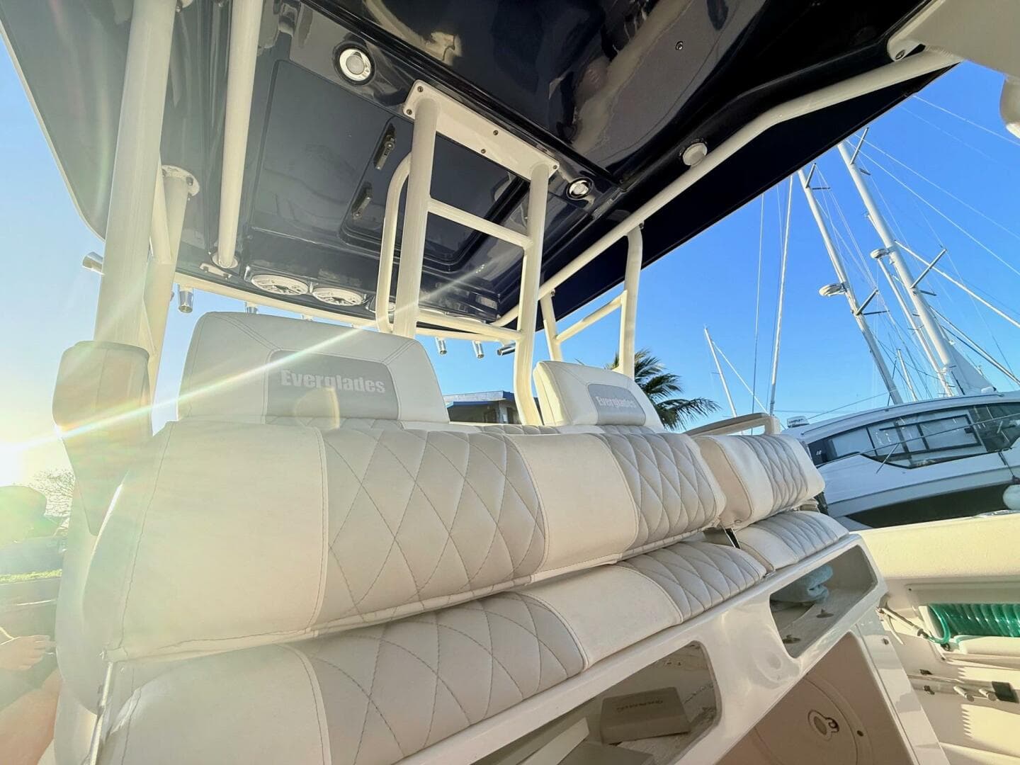 2014 Everglades 355 Center Console boat interior with white seating and overhead view.
