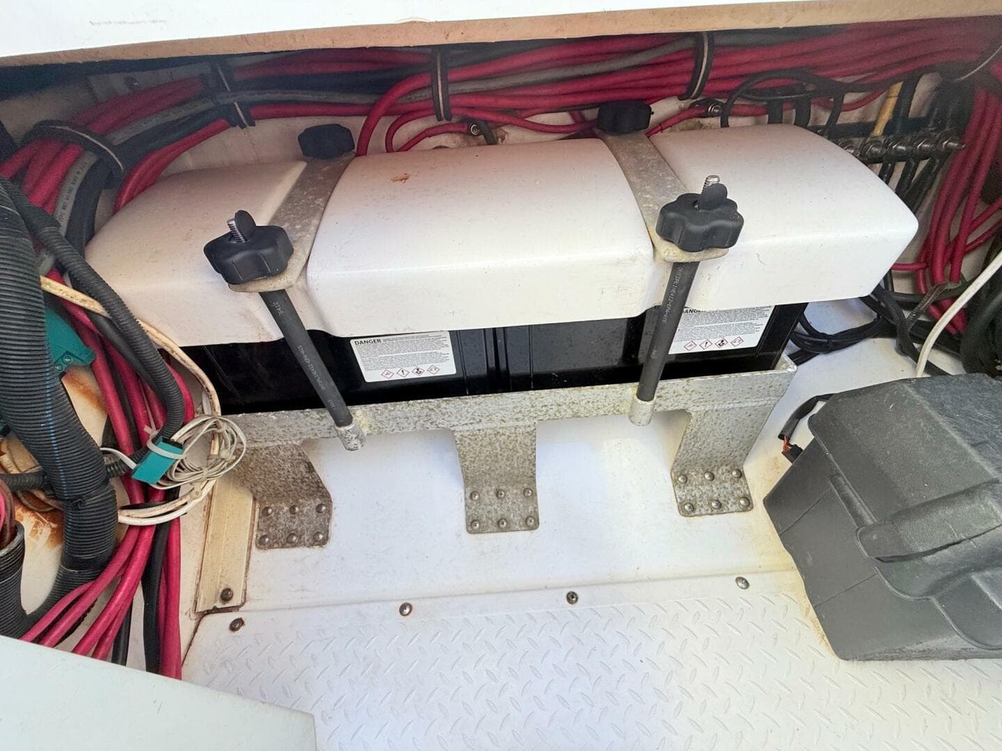 2014 Everglades 355 Center Console battery compartment with wiring and secure mounts.