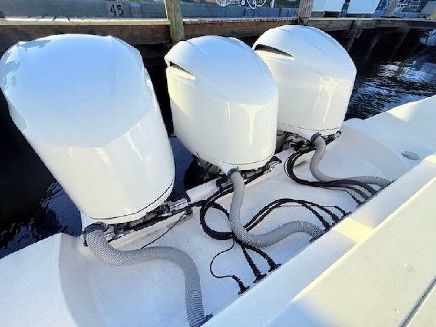 Triple outboard engines on a 2014 Everglades 355 Center Console boat.