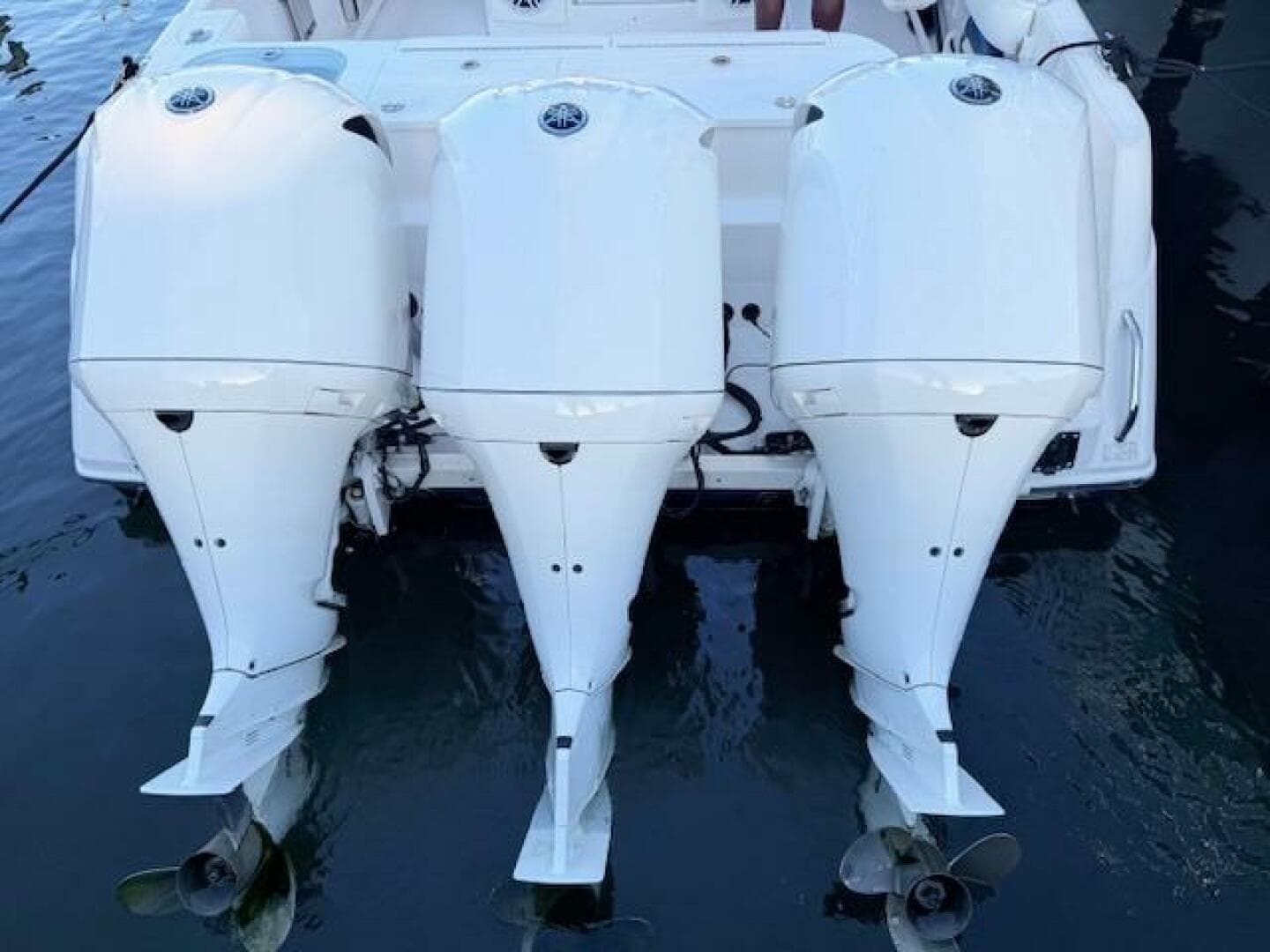 Triple outboard engines on a 2014 Everglades 355 Center Console boat.