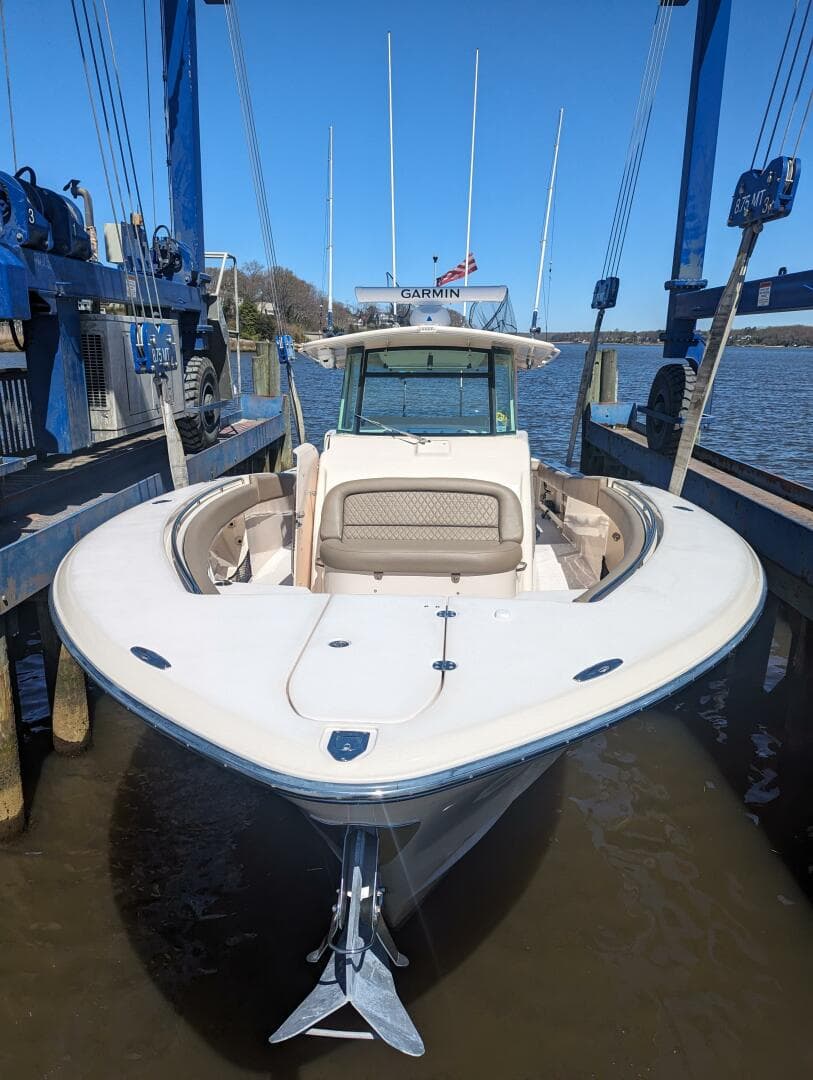 2012 Grady-White Canyon 366 boat docked, front view, in a marina setting.
