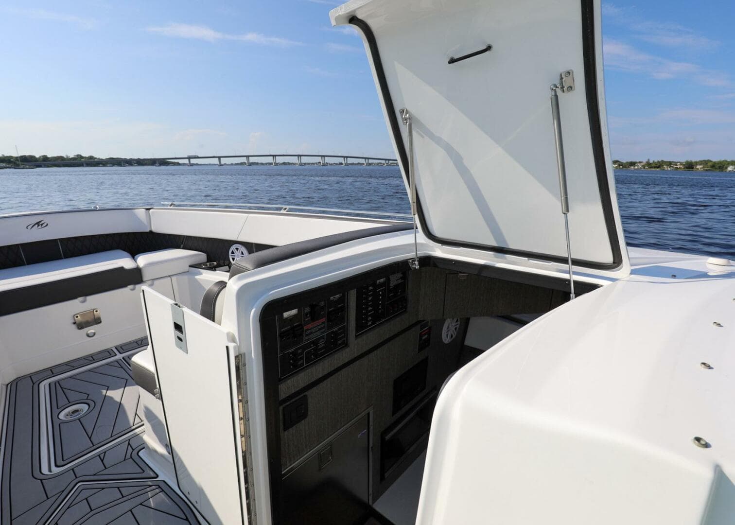 2023 Monterey 385 Super Sport boat interior with open hatch, on calm water.