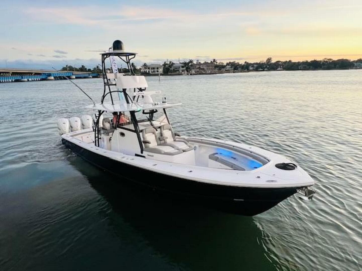 2024 Regulator 41 boat on calm water at sunset.