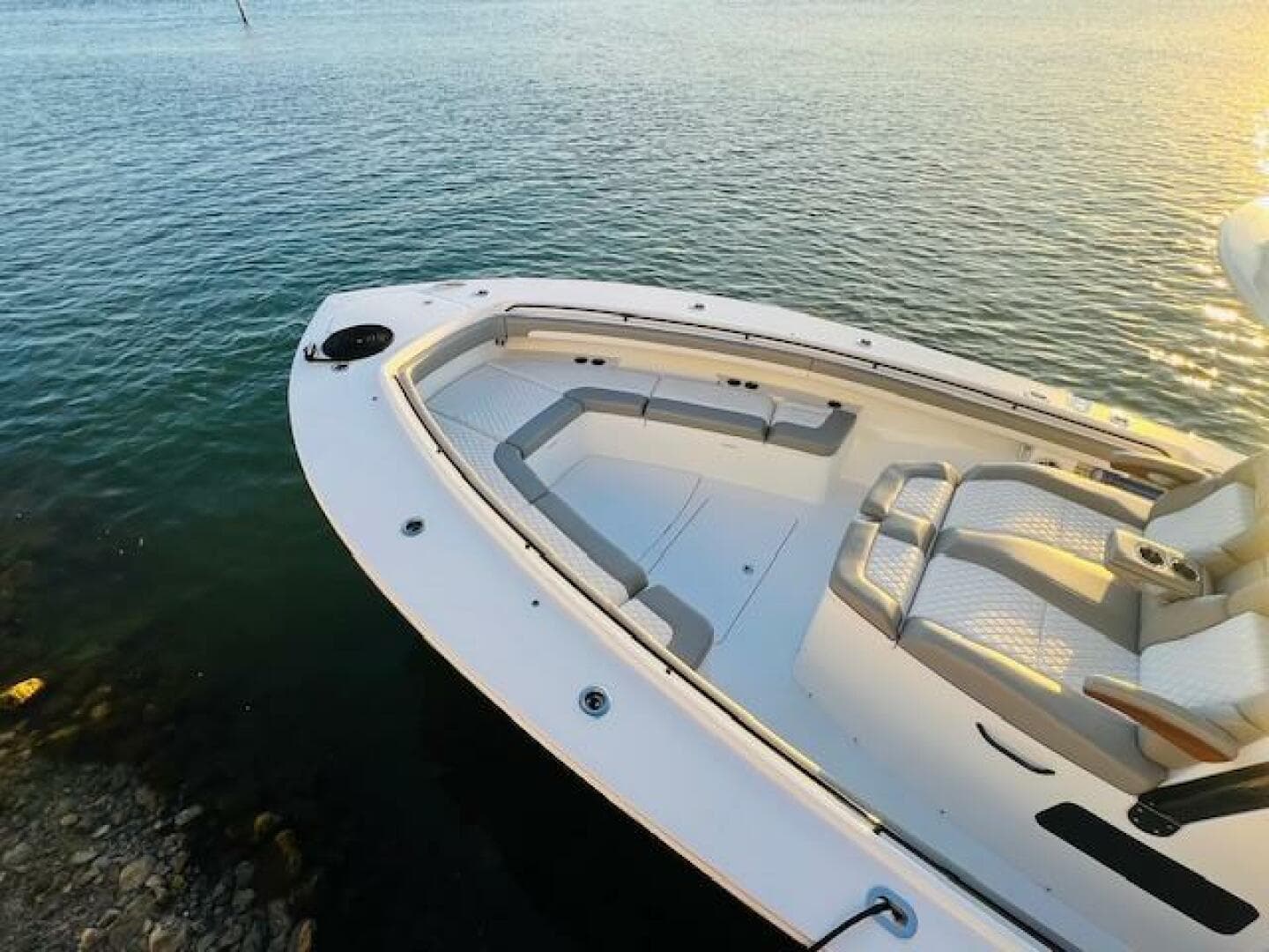 2024 Regulator 41 boat with spacious seating, docked on calm water.