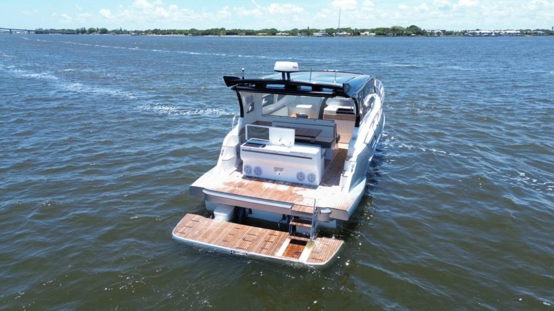 Luxury yacht "Real 40 HT" cruising on open water, 2025 model.