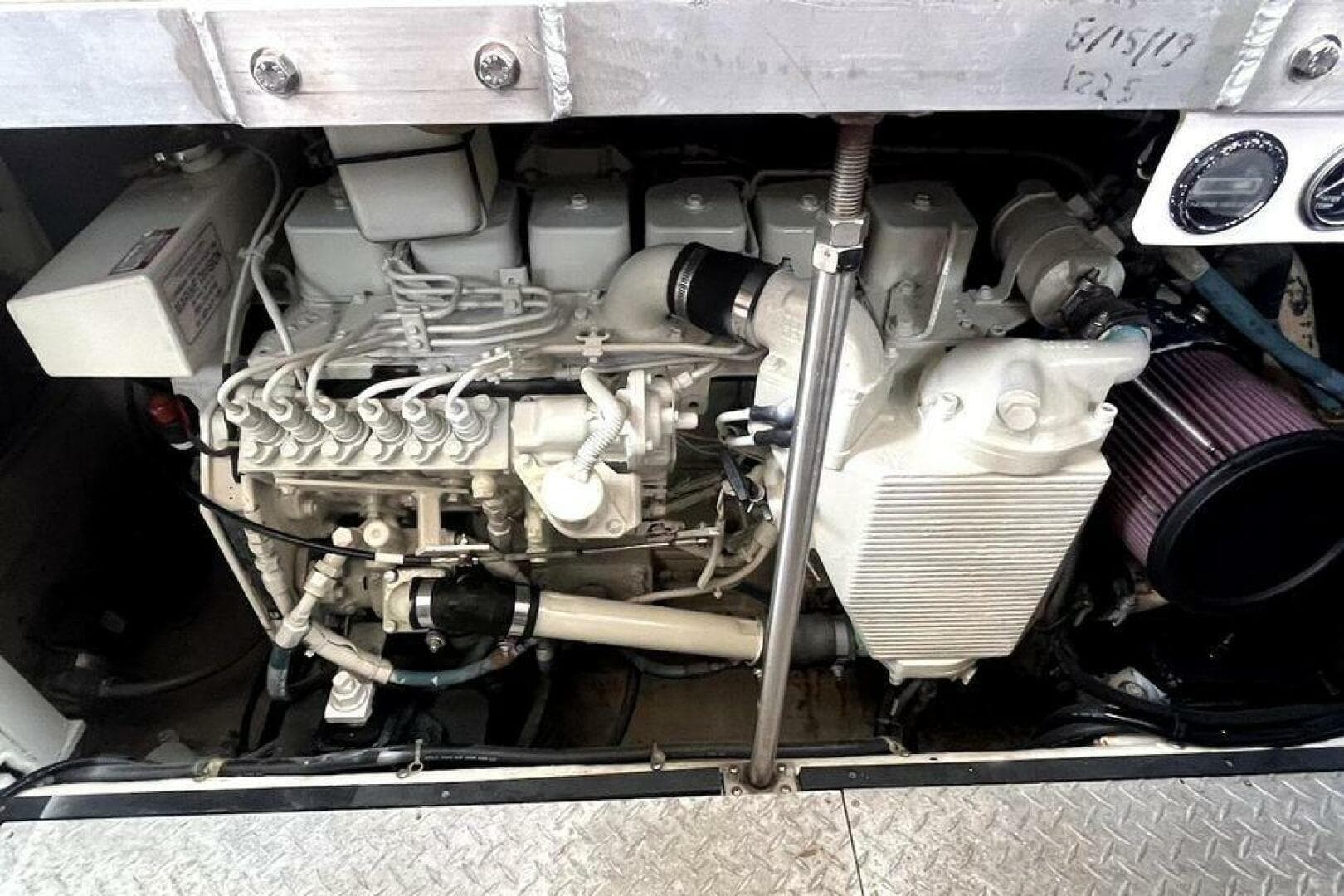 Engine compartment of a 2000 Carver 396 Motor Yacht, showcasing mechanical components.