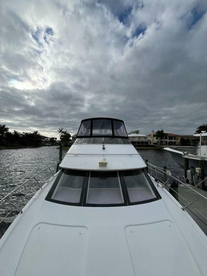 2000 Carver 396 Motor Yacht docked under cloudy skies.