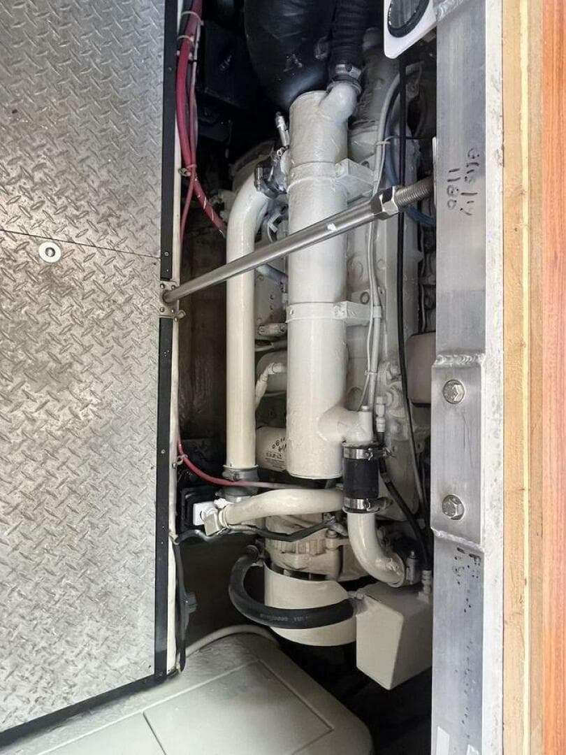 Engine compartment of a 2000 Carver 396 Motor Yacht, showcasing mechanical components.