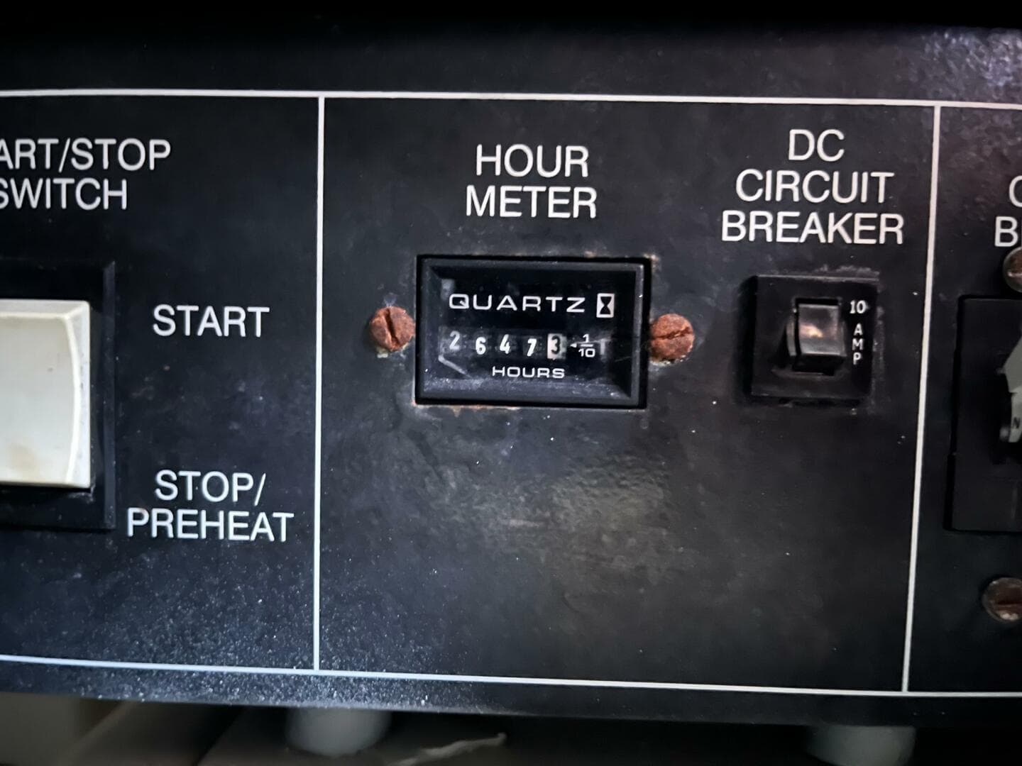 Control panel of 2000 Carver 396 Motor Yacht with hour meter and circuit breaker.