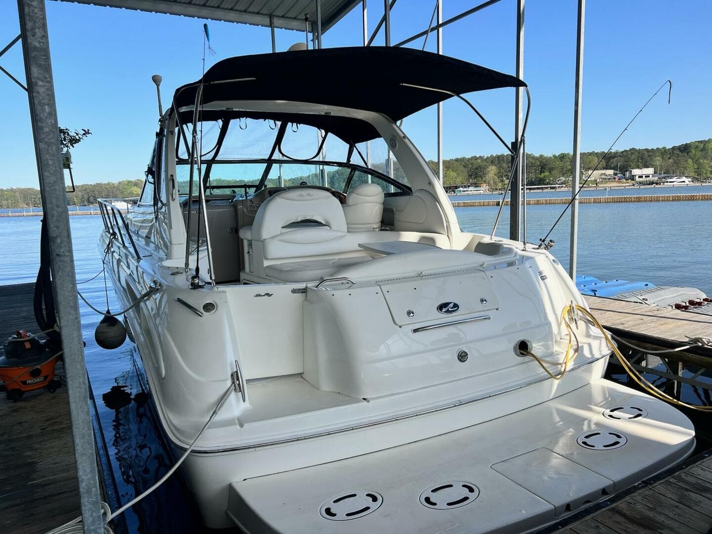 2001 Sea Ray 380 Sundancer docked, featuring sleek design and spacious deck.