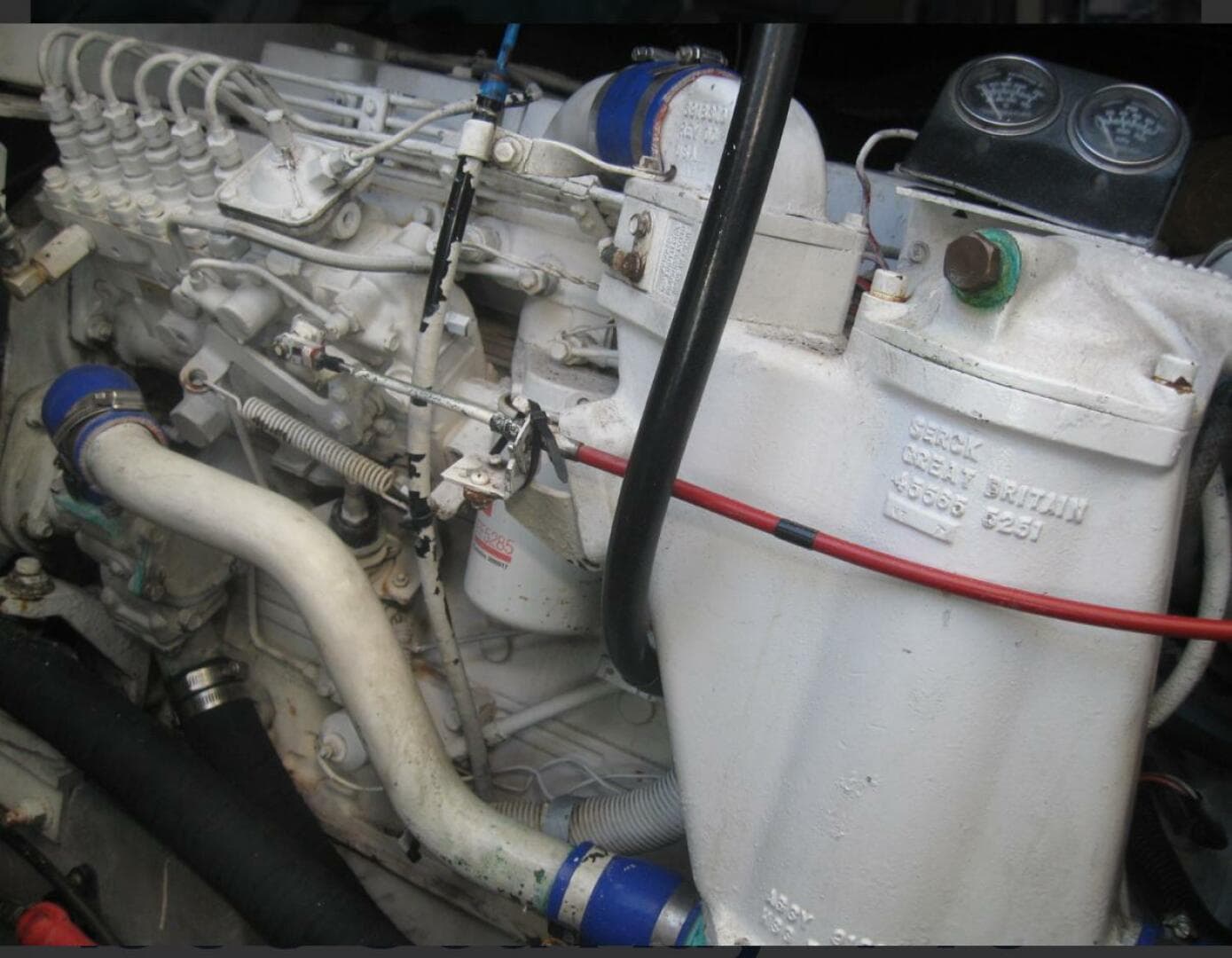 Engine of a 1993 Sea Ray 440 Sundancer boat, showcasing intricate mechanical components.