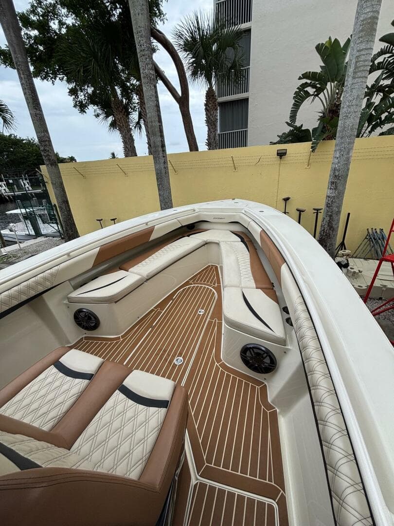 2013 Statement 35 Center Console boat with luxurious seating and teak flooring.