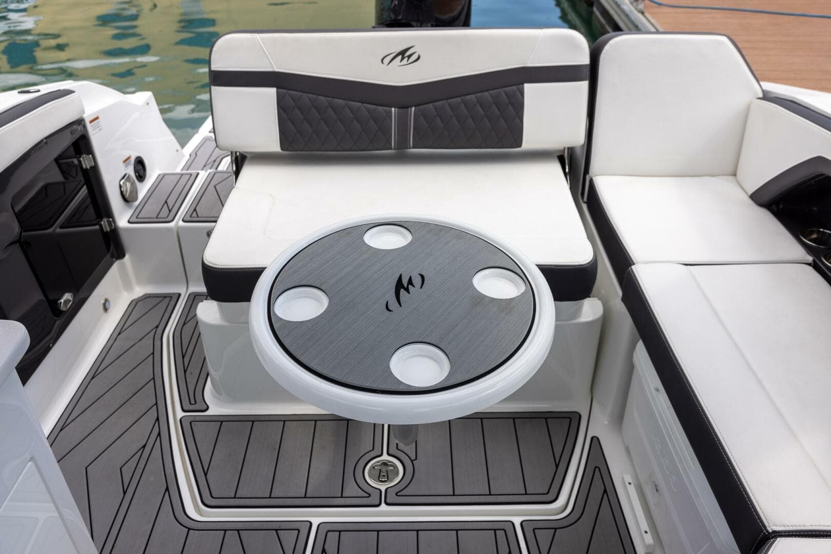 2023 Monterey 255 Super Sport boat interior with seating and table.