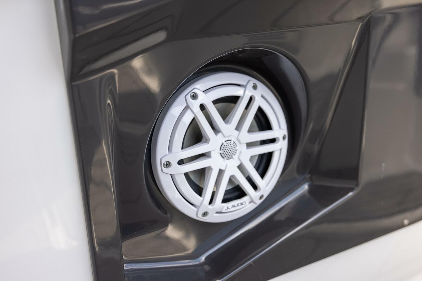 Speaker detail on 2023 Monterey 255 Super Sport boat, featuring sleek design and modern audio system.