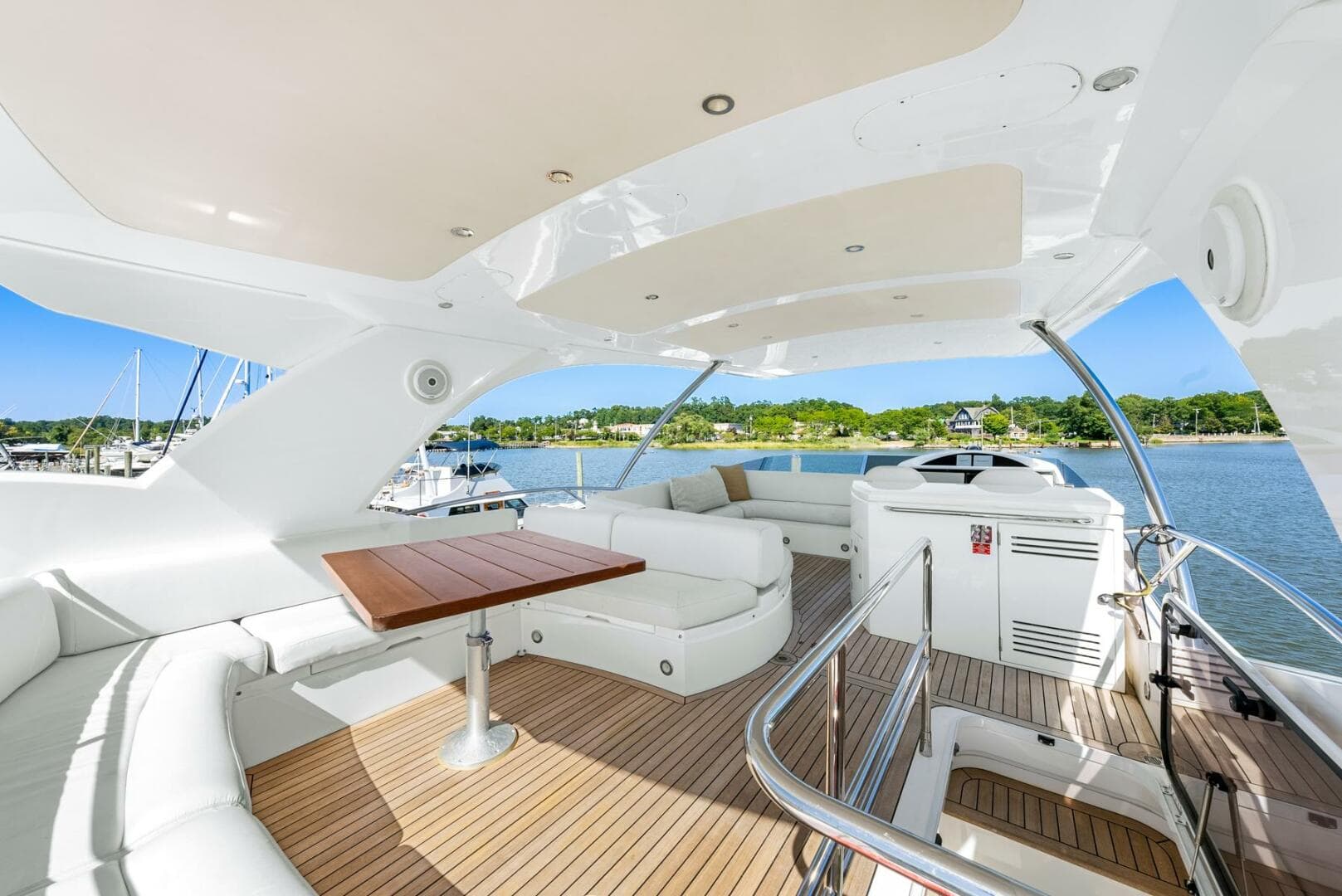 Luxurious Sunseeker Manhattan 65 yacht interior, 2016 model, featuring elegant seating and scenic views.