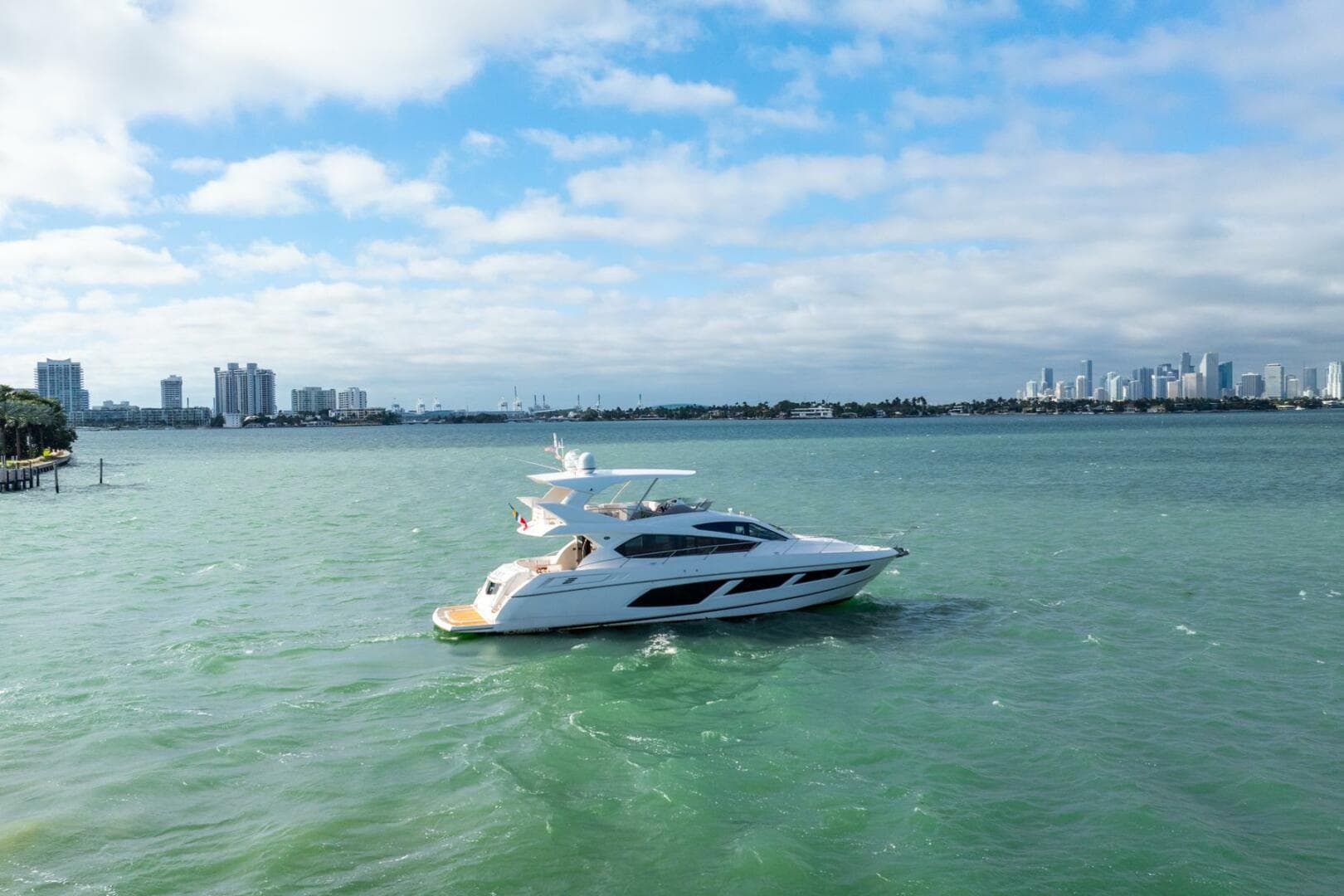 Sunseeker Manhattan 65 yacht cruising on a sunny day, 2016 model.