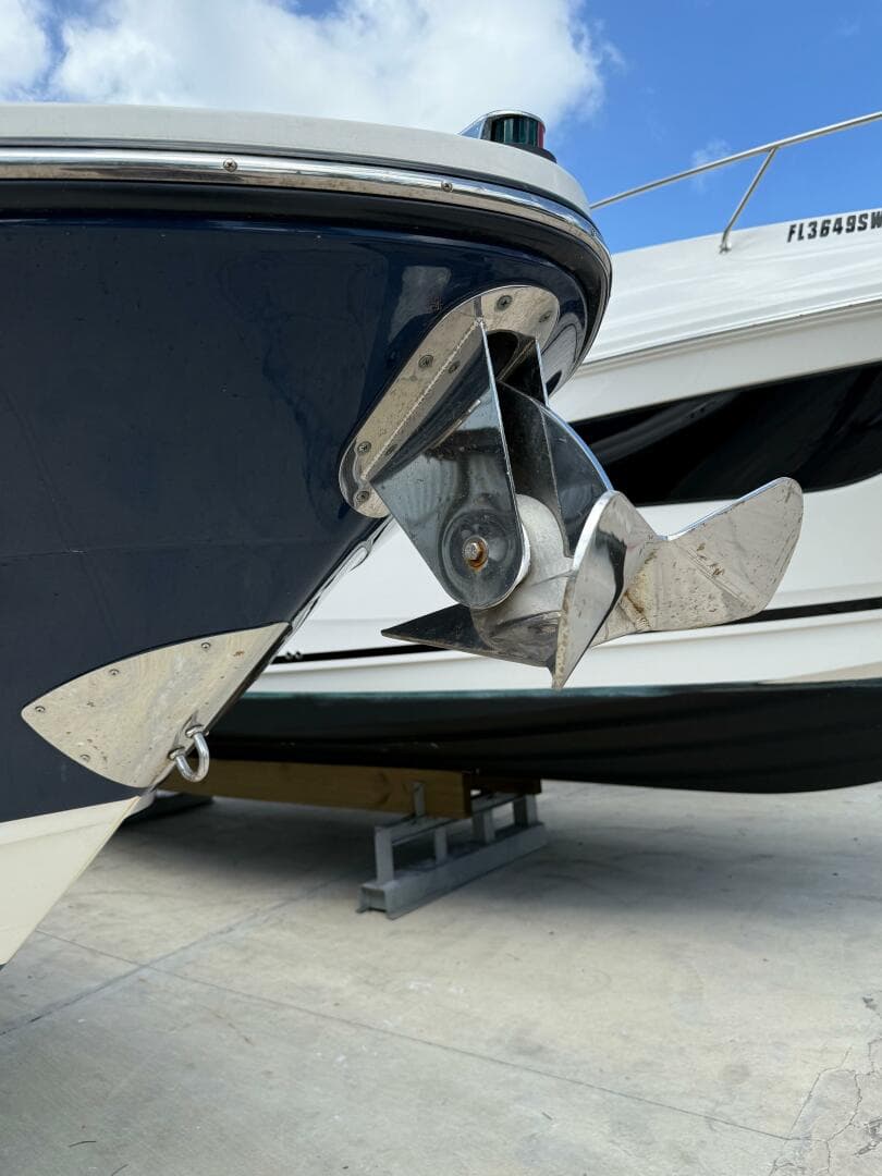 2014 Sea Ray 270 SLX boat anchor detail with blue hull and clear sky background.