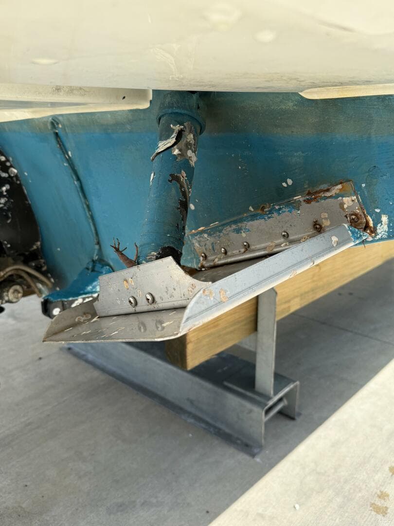 Damaged hull of 2014 Sea Ray 270 SLX boat on stand.