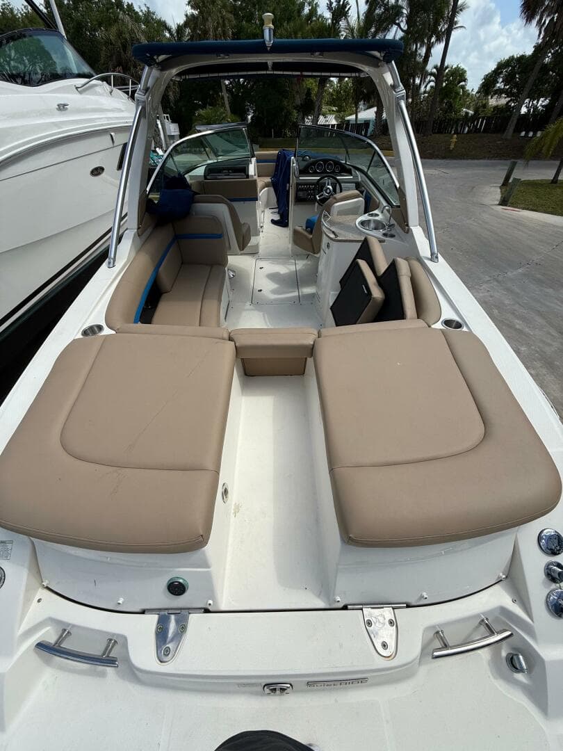 2014 Sea Ray 270 SLX boat with beige seating and sleek design.