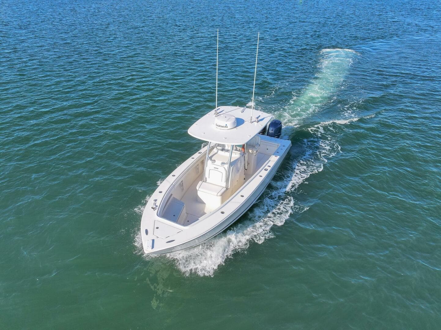 2018 Jupiter 26 FS boat cruising on open water, aerial view.