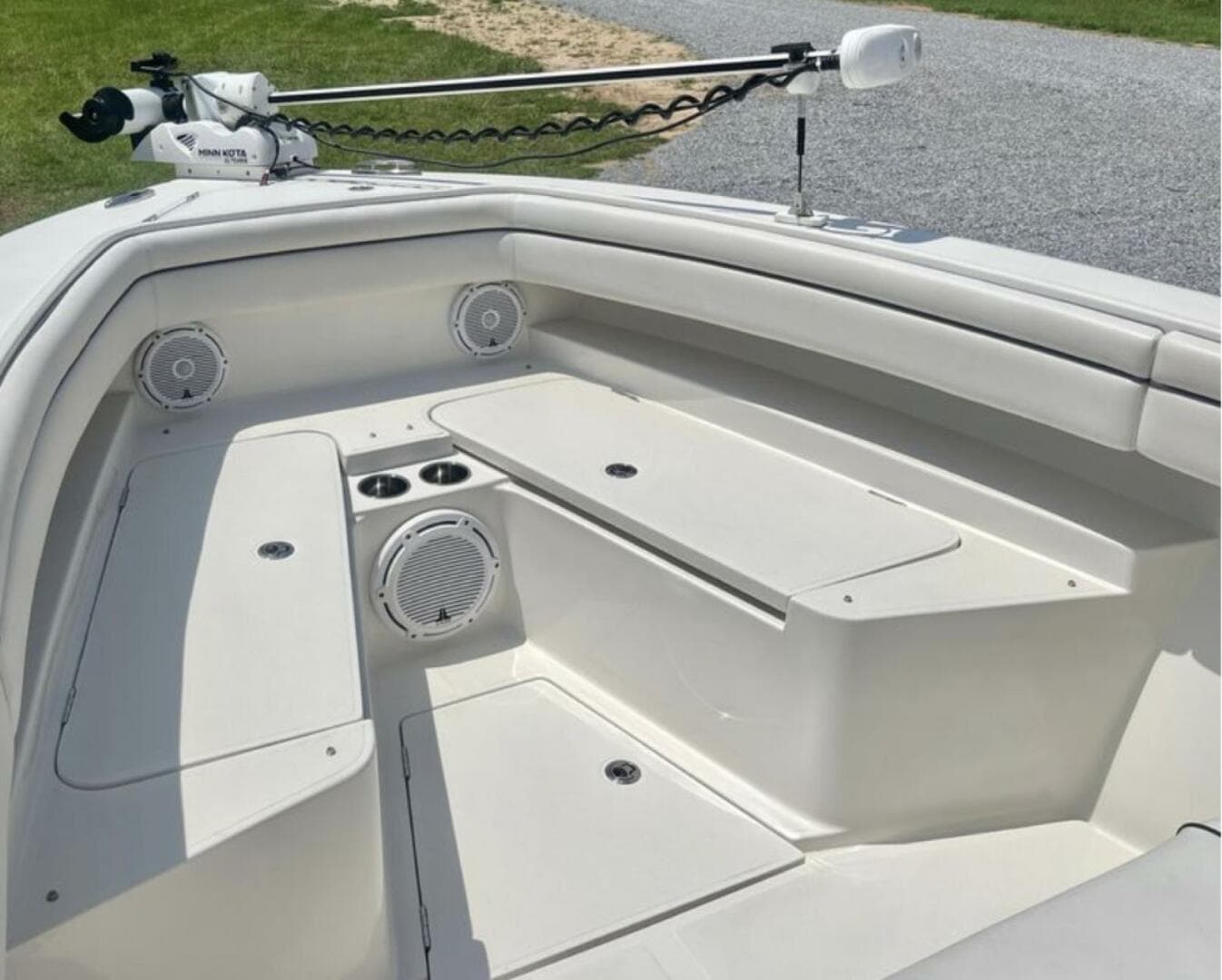2018 Jupiter 26 FS boat interior with seating, speakers, and storage compartments.