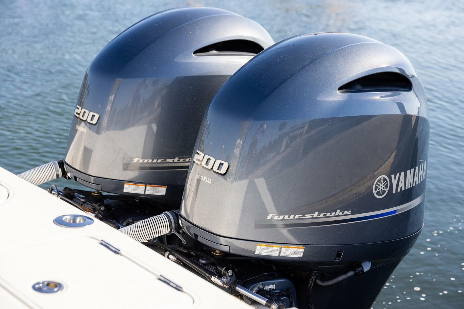 Twin Yamaha 200 four-stroke outboard engines on a 2018 Jupiter 26 FS boat.