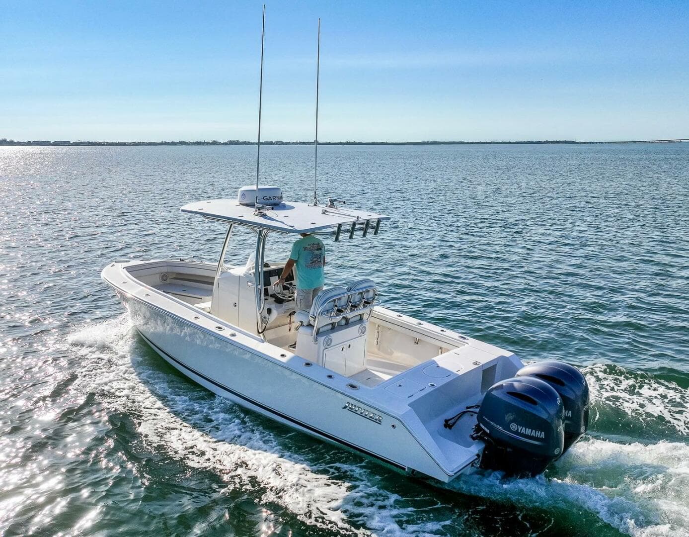 2018 Jupiter 26 FS boat cruising on open water with Yamaha engines.