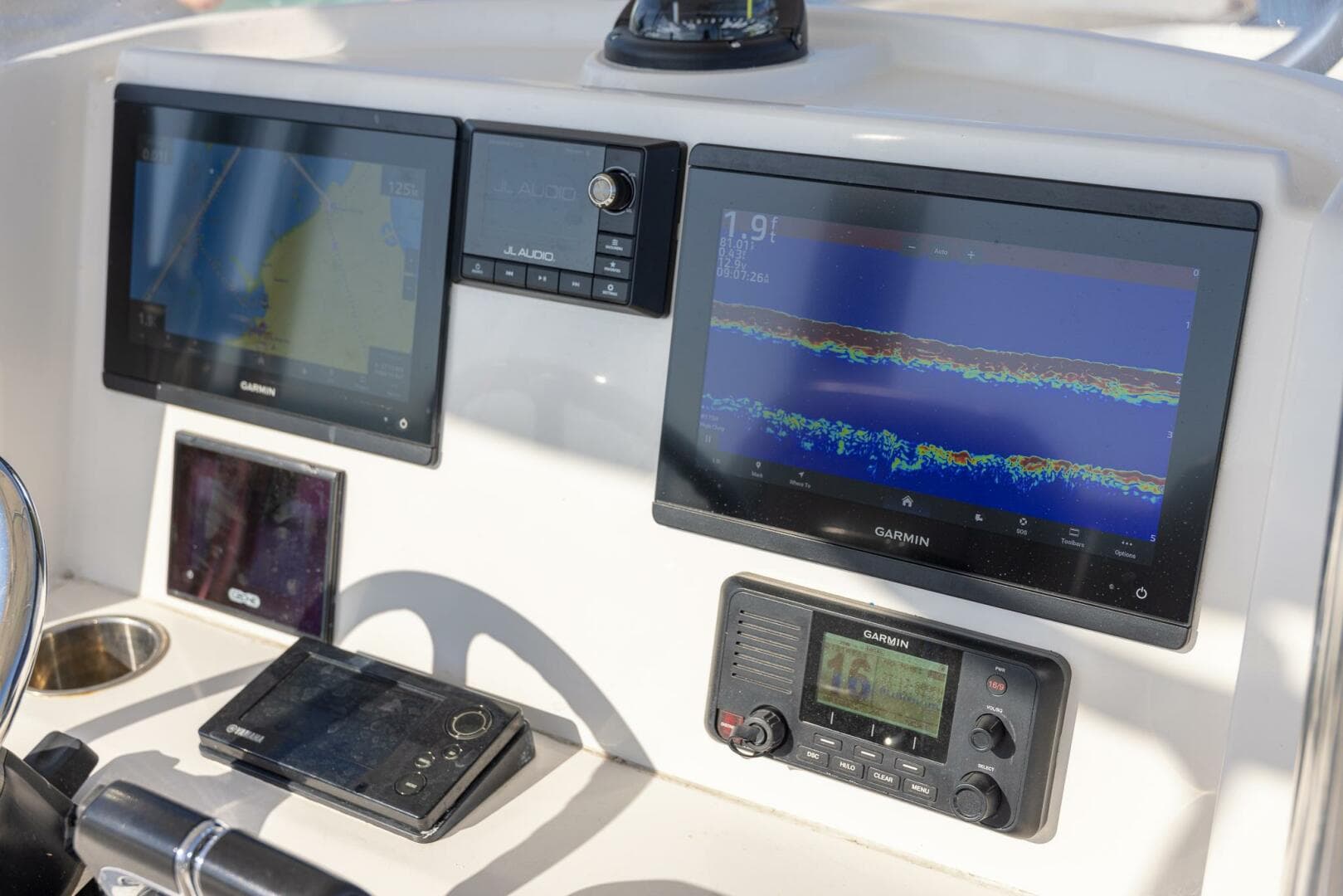 Control panel of 2018 Jupiter 26 FS boat with Garmin navigation displays.