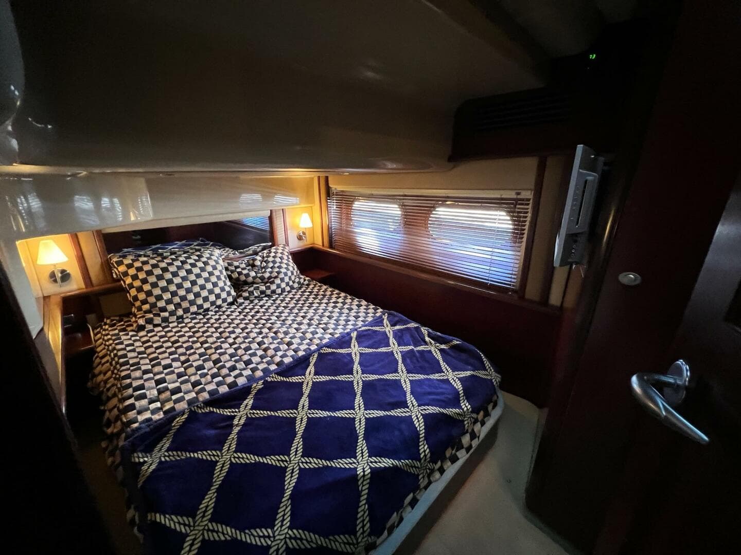 Luxurious bedroom interior of 2005 Sea Ray 500 Sedan Bridge yacht.