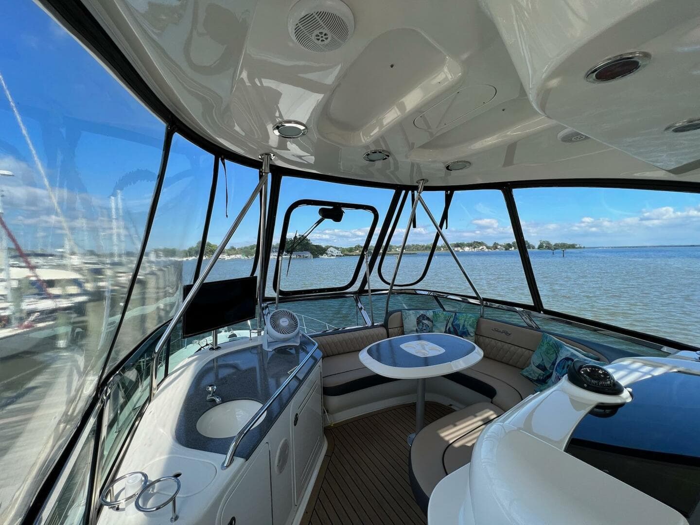 Interior view of 2005 Sea Ray 500 Sedan Bridge yacht with seating and navigation equipment.